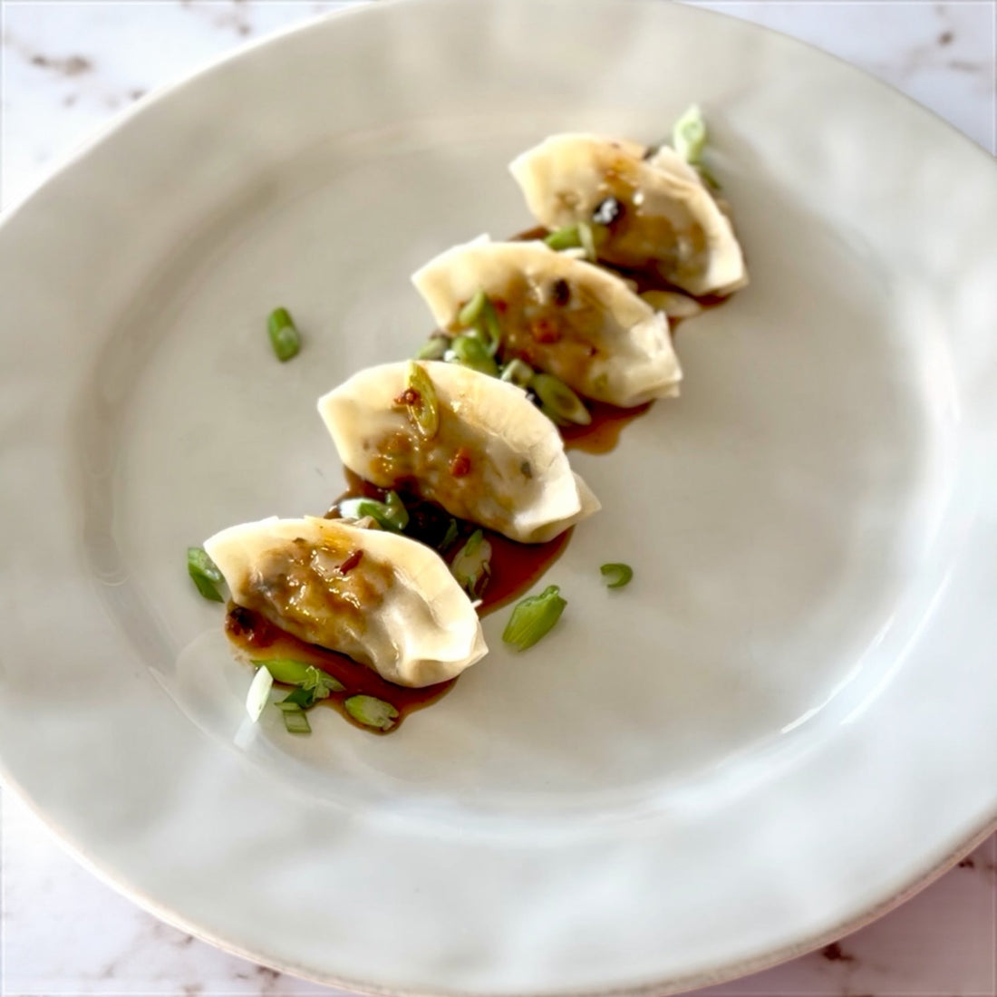 Smoked Salmon Gyoza with Chili Crisp Dipping Sauce